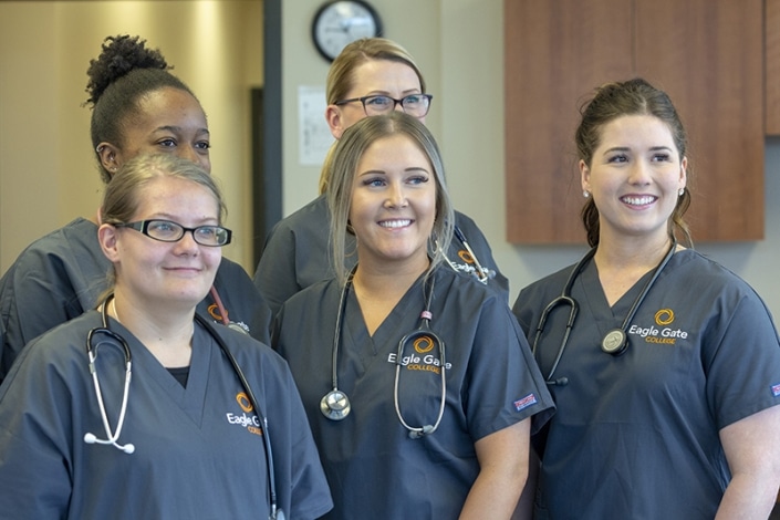 Students in scrubs posing for a photo