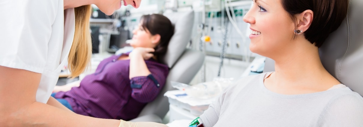 Phlebotomy Technician taking blood from a patient