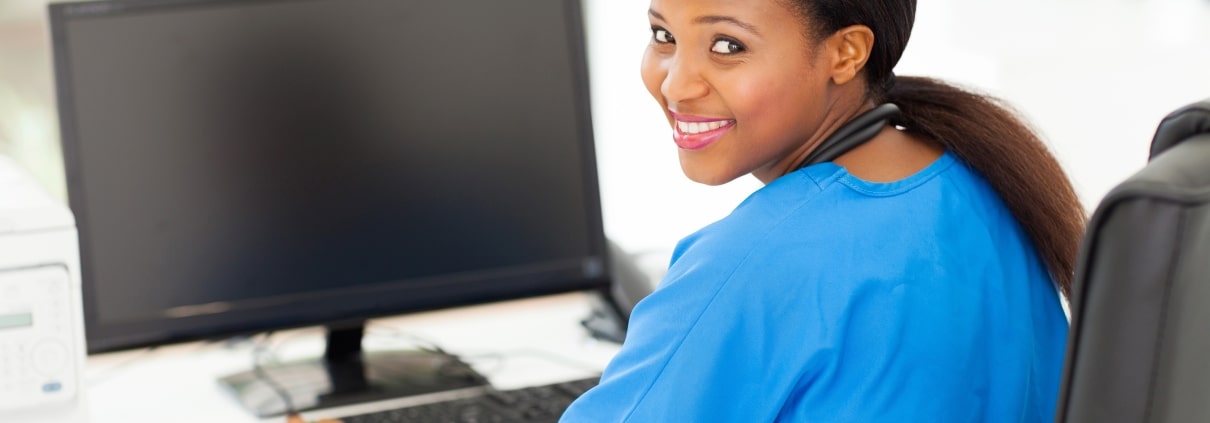 African-American nurse using a computer