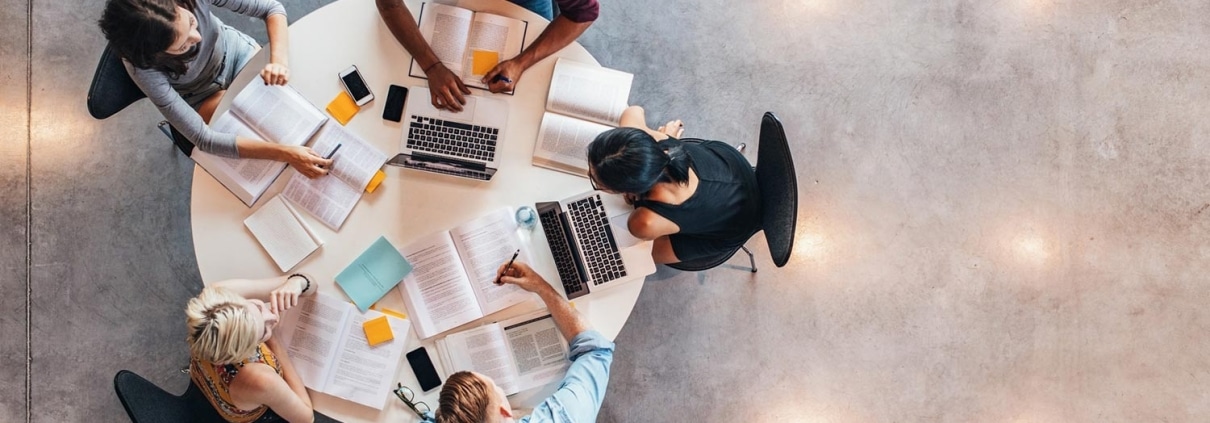 Aerial view of medical students studying at a table
